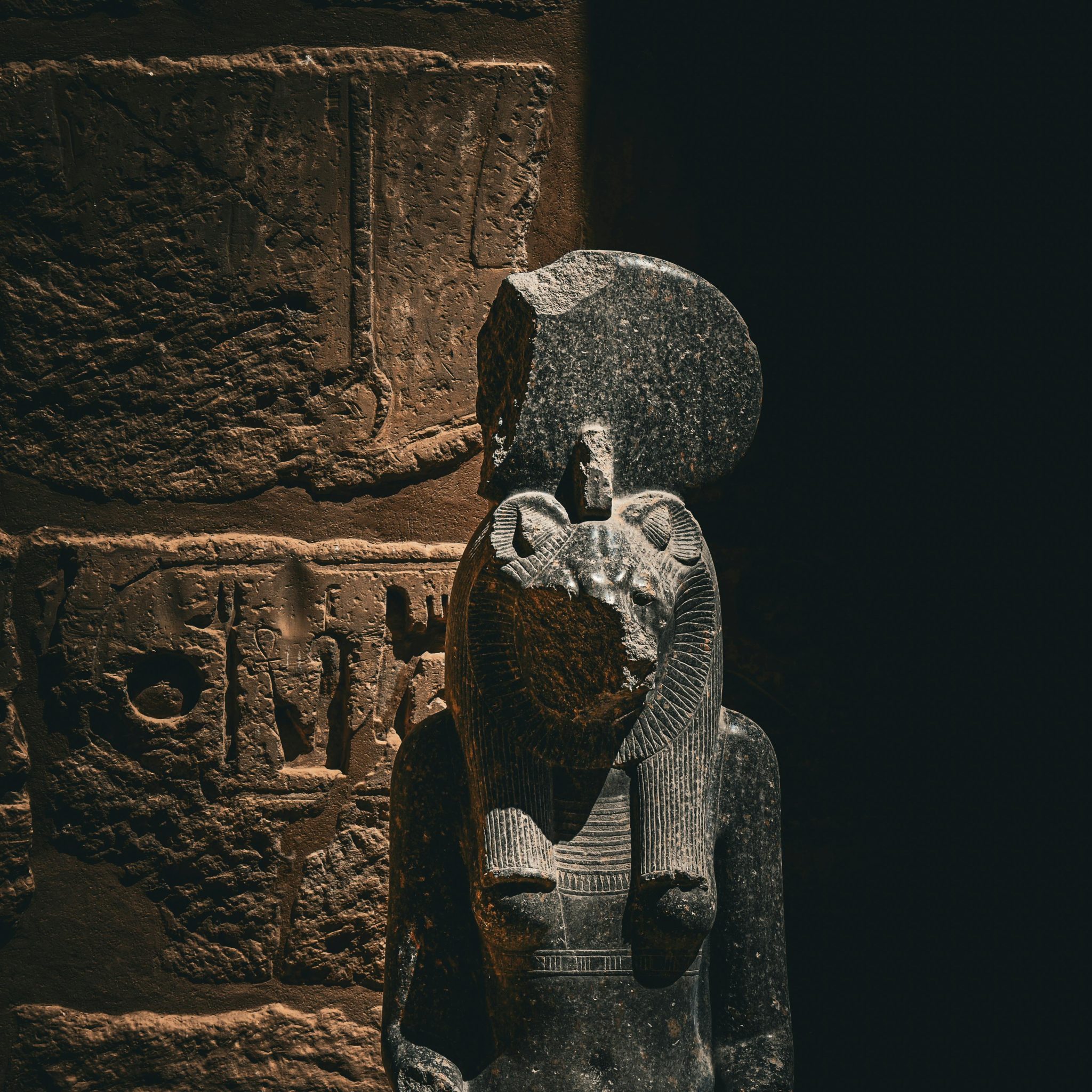 Close-up of a statue with hieroglyphs at Madinat Habu, Egypt.